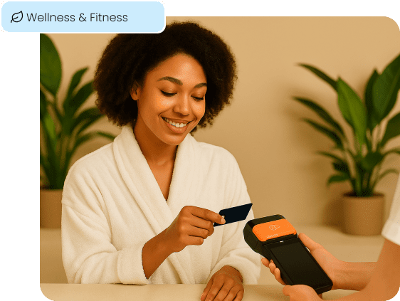A client at a wellness center makes a quick contactless payment, illustrating the seamless checkout experience for the wellness and fitness industry.